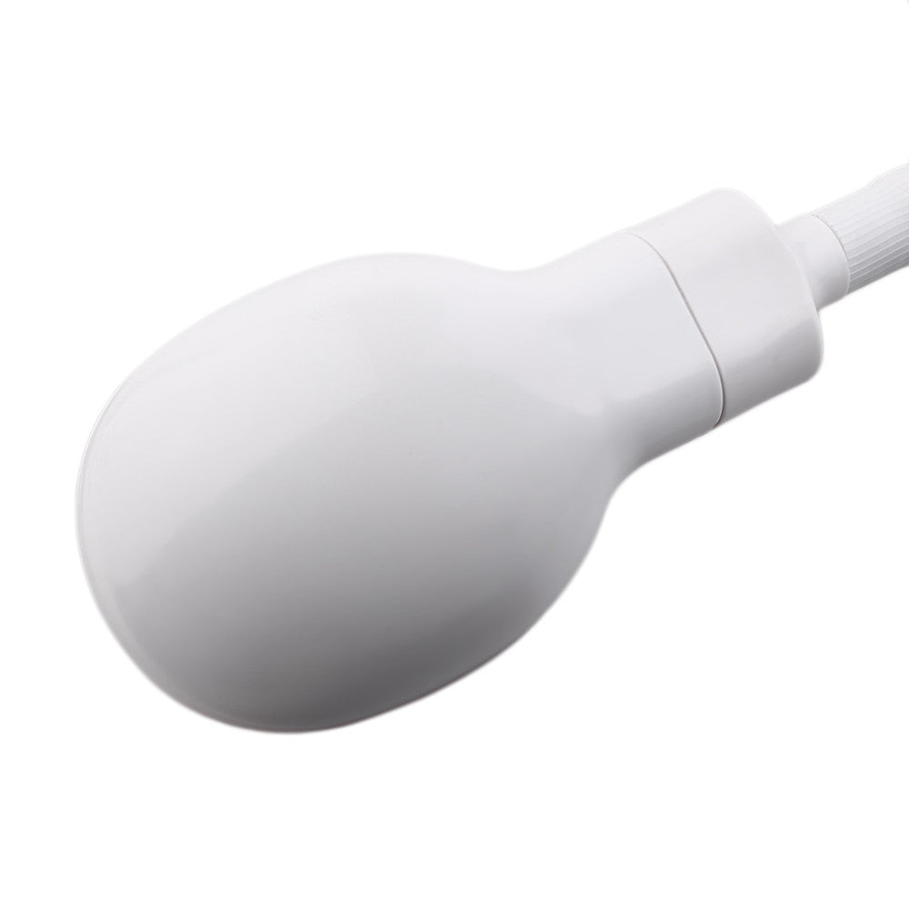 Close-up of white oval-shaped shower head