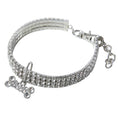 Charger l'image dans la visionneuse de la galerie, Clear rhinestone dog collar laid flat with bone-shaped crystal pendant and adjustable clasp
