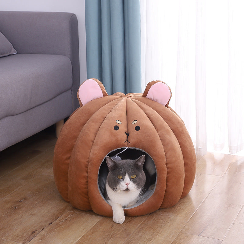 Brown plush enclosed pet bed shaped like a bear head with a gray cat lounging inside