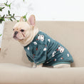 Load image into Gallery viewer, French bulldog sitting on beige couch in dark green plush pajamas with cute cow prints
