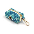 Load image into Gallery viewer, Close-up of blue tie-dye zippered waste bag holder with gold clip
