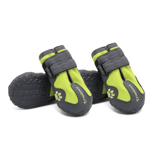 Pair of green and gray waterproof dog shoes with velcro straps displayed on white background