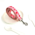 Load image into Gallery viewer, Leash coiled on white dish with plastic cutlery on white surface
