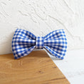 Load image into Gallery viewer, Blue and white checkered bow tie accessory for dog collar on wooden surface
