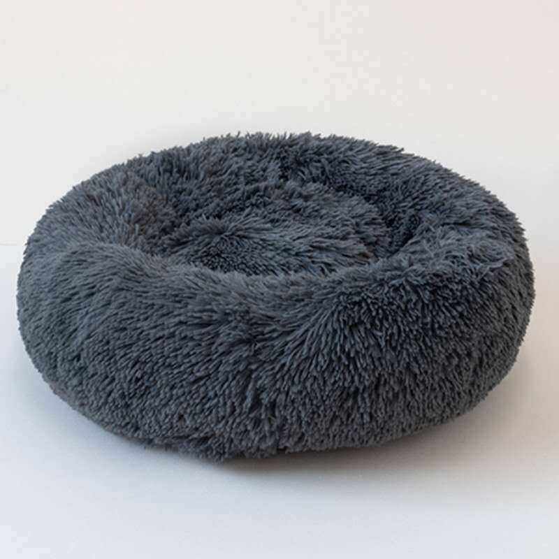 Dark gray plush round pet bed with raised edges made of soft faux fur