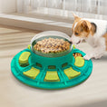 Load image into Gallery viewer, Dog pawing at teal and green puzzle feeder with clear dome full of kibble in living room
