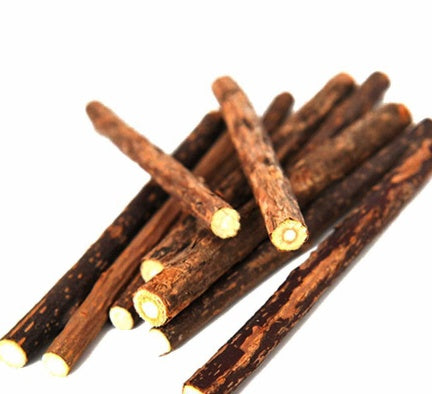 Pile of natural Matatabi sticks with bark surface and exposed white inner core