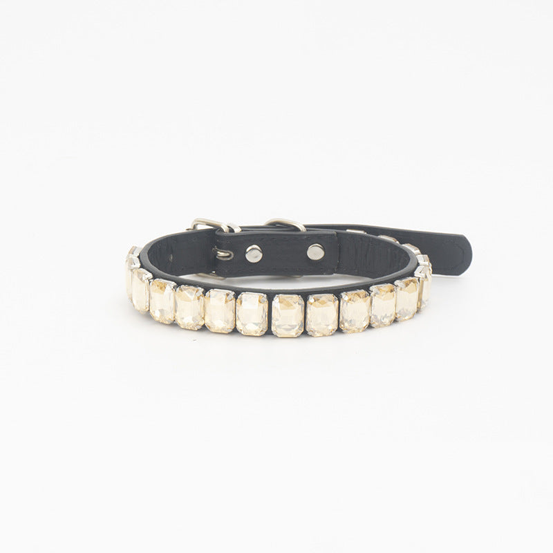 Transparent beige rhinestone PU pet collar laid flat on white background