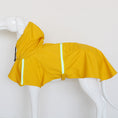 Cargar la imagen en la vista de la galería, Yellow waterproof reflective dog raincoat on a mannequin with reflective stripes and hood
