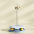 Load image into Gallery viewer, Blue interactive cat treat toy with clear treat container and spring stem on soft beige background
