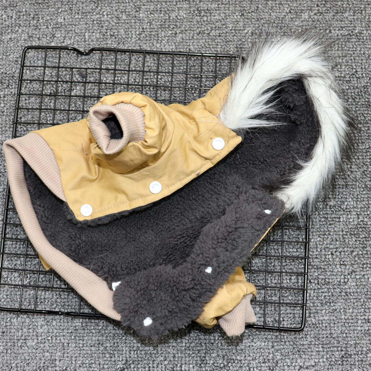 Inside view of the khaki dog coat showing soft plush fleece lining and button closures
