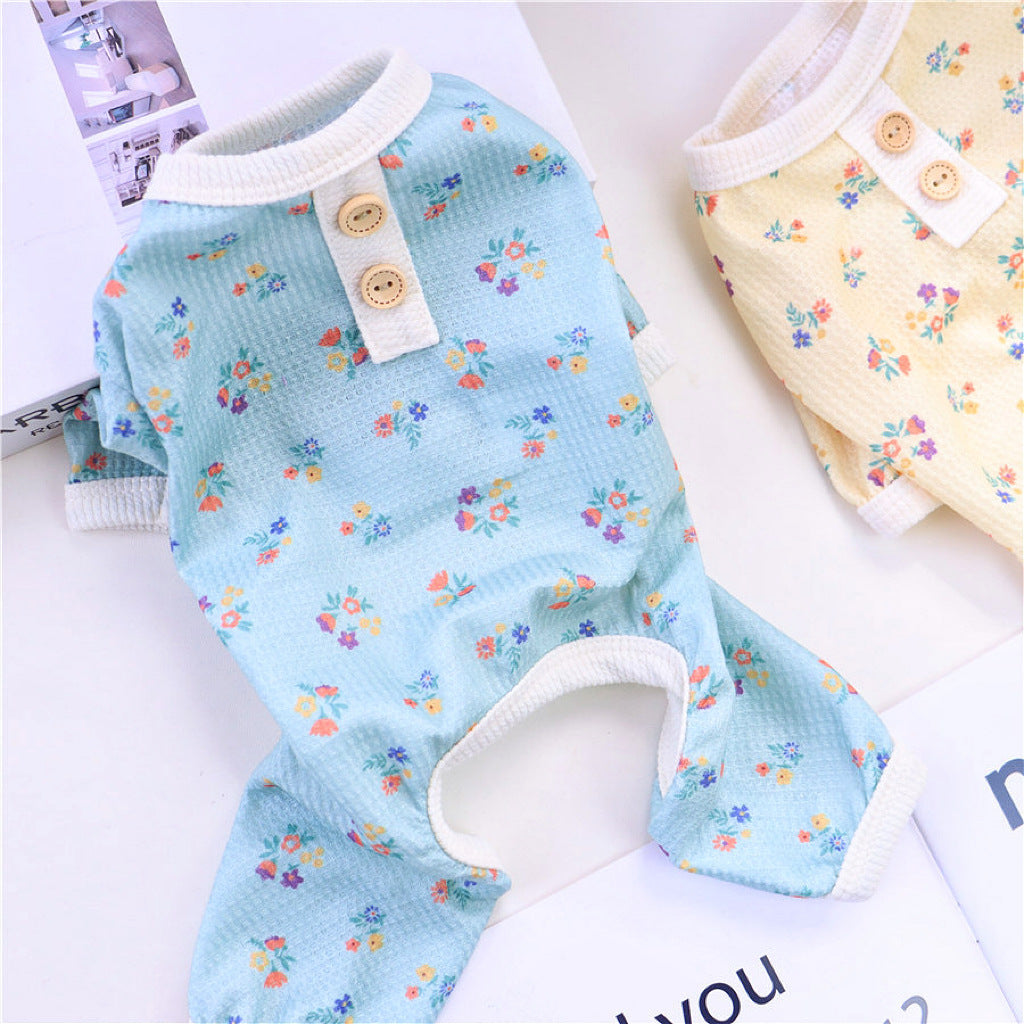 Blue floral dog pajamas laid flat with ribbed collar and sleeve trims