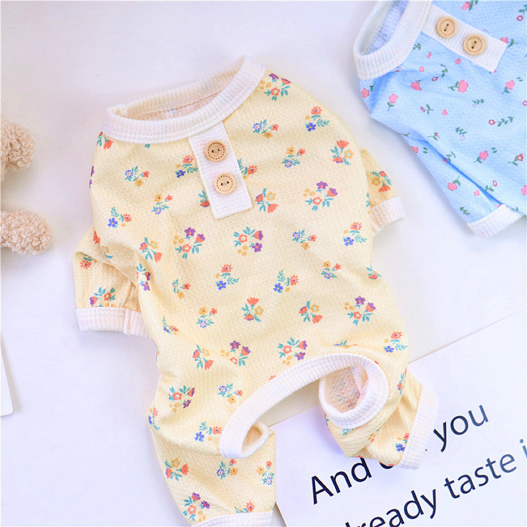 Blue floral dog pajamas displayed with white ribbed trims on cuffs and collar