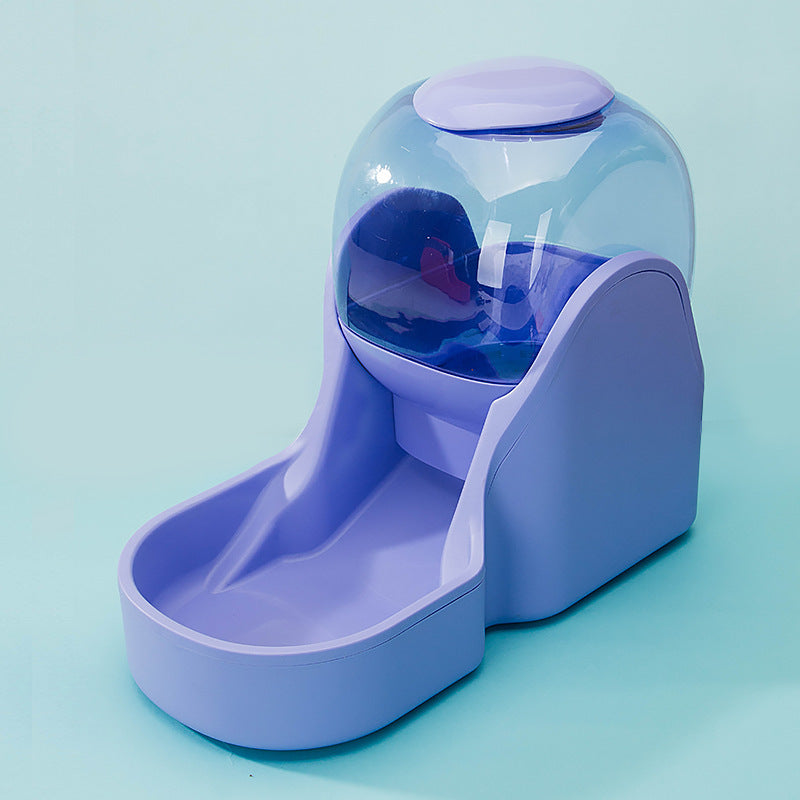 Purple automatic pet feeder fountain showing feeding basin and lid on light blue background
