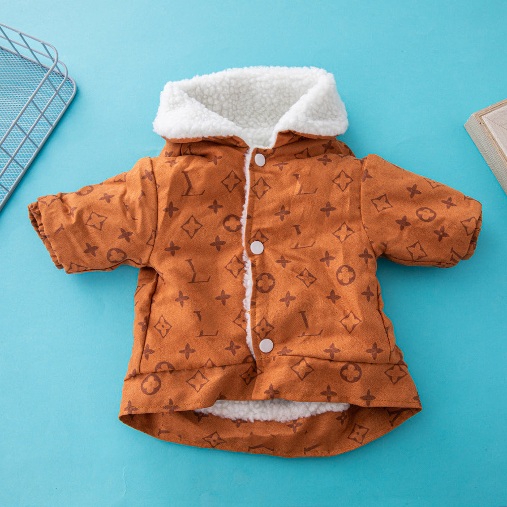 Front view of orange-brown dog jacket with fleece collar and button closure laid flat on blue background