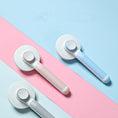 Load image into Gallery viewer, Three Round Handle Pet Hair Combs in gray, pink, and blue on pastel background
