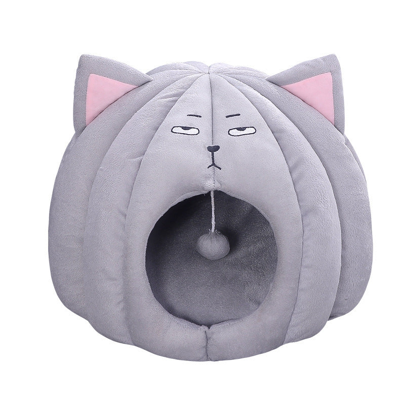 Gray plush enclosed cat bed shaped like a cat head with pink ears and sleepy embroidered eyes