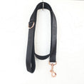 Load image into Gallery viewer, Full view of black satin pet leash hanging with rose gold hardware
