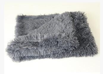 Dark gray plush pet blanket folded neatly