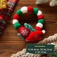 Load image into Gallery viewer, Close-up of a plush Christmas collar decorated with red and green felt balls and plush ornaments including a Santa hat and holiday berry

