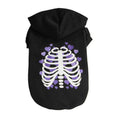 Charger l'image dans la visionneuse de la galerie, Black dog hoodie with white skeleton rib cage and purple heart shapes in background
