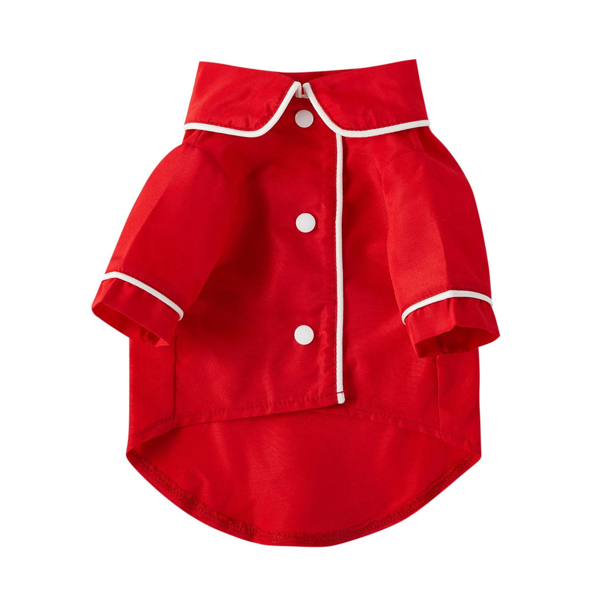Red pet pajamas shirt displayed on flat surface with white piping
