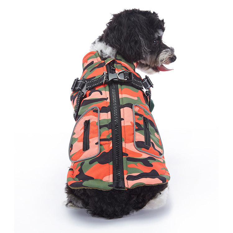 Black and white dog on white background modeling orange camo insulated dog jacket with adjustable harness straps  