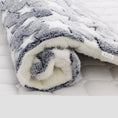 Load image into Gallery viewer, Rolled plush pet blanket with gray star pattern and thick white fleece backing
