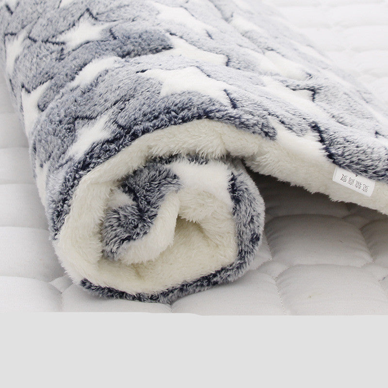 Rolled plush pet blanket with gray star pattern and thick white fleece backing