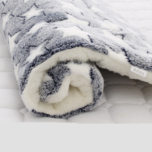 Rolled plush pet blanket with gray star pattern and thick white fleece backing