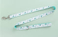 Load image into Gallery viewer, Leash fully extended showing silver clasp and leaf pattern
