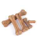 Charger l'image dans la visionneuse de la galerie, Various sizes of natural buffalo leather dog chew bones in classic bone shape
