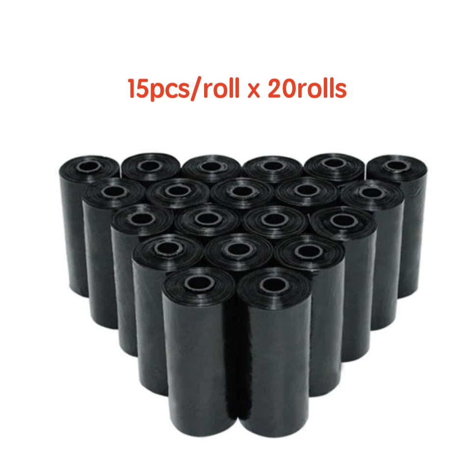 Bulk rolls of black dog waste bags stacked in pyramid shape