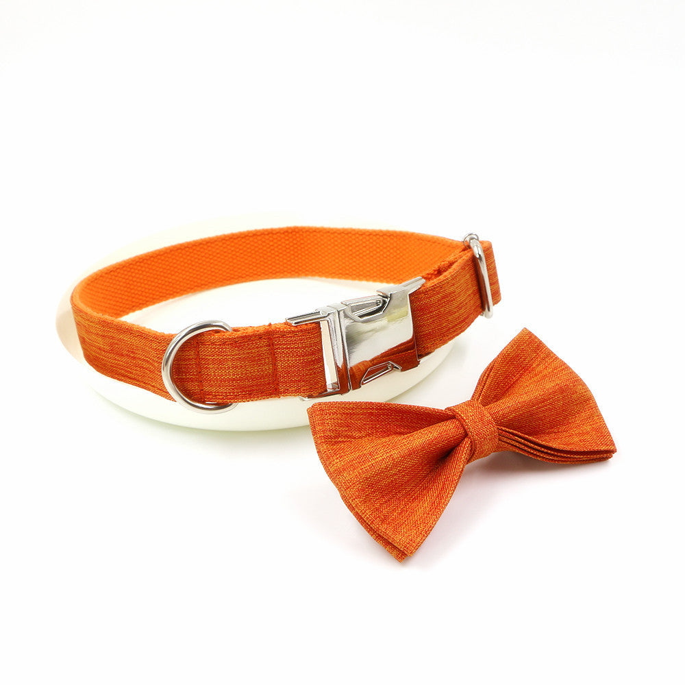 Orange polyester dog collar with silver metal buckle and detachable bow