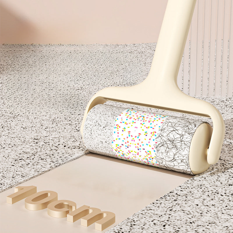 Sticky hair roller removing pet hair and lint from terrazzo surface