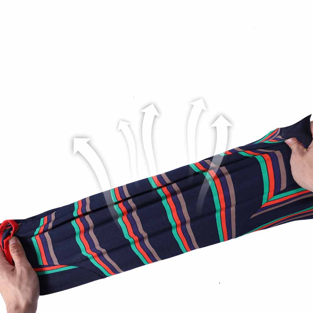 Close-up of dark blue striped pajamas fabric being stretched showing elasticity