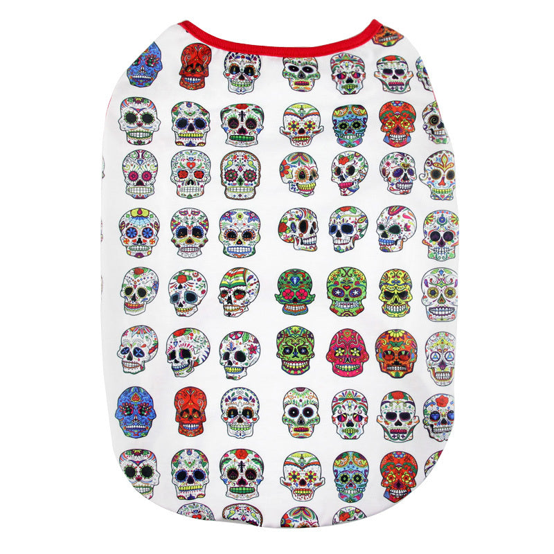 Flat lay of white dog shirt printed with detailed colorful sugar skulls and red neckline