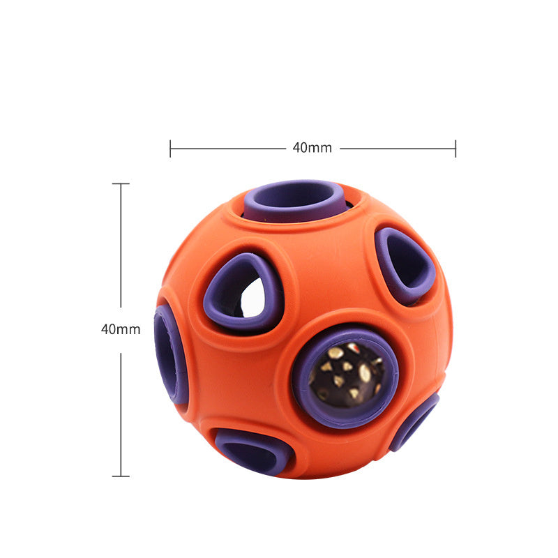 Close-up of an orange and purple dog toy ball measuring 40mm with triangular openings and a bell inside.