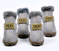 Cargar la imagen en la vista de la galería, Pair of light gray dog boots with faux fur lining and visible stitching
