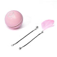 Load image into Gallery viewer, Pink LED light cat toy ball with detachable black string attachments including a pink feather and a bell on white background
