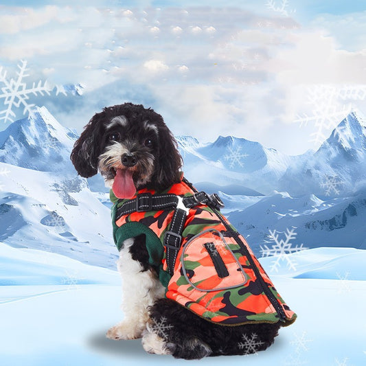 Small black and white dog outdoors wearing a warm orange camo fleece dog jacket with zippered pockets  
