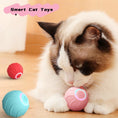 Load image into Gallery viewer, Red and pink smart cat toy balls with a cat playing holding the pink ball
