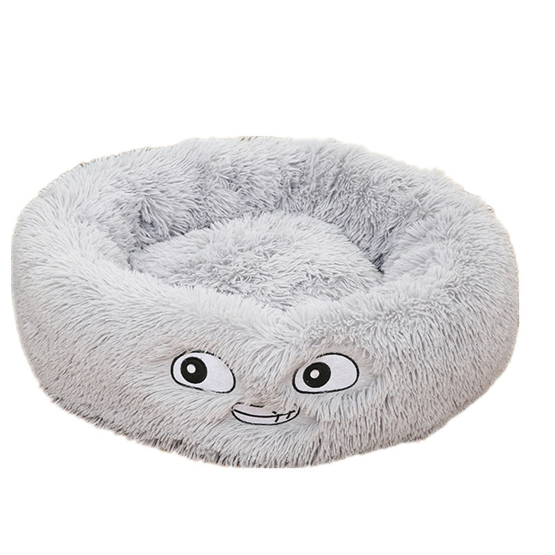 Grey plush round pet bed with embroidered playful eyes and mouth