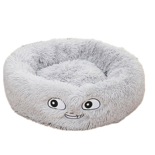 Grey plush round pet bed with embroidered playful eyes and mouth