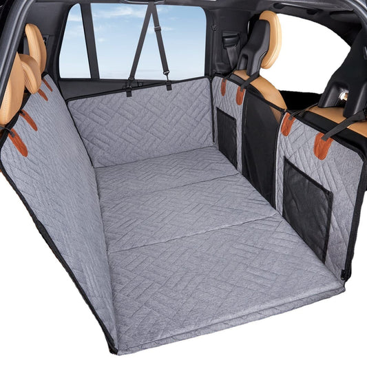 Gray quilted waterproof dog seat cover set up in back seat of car