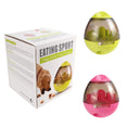 Load image into Gallery viewer, Package box labeled Eating Sport next to two interactive pet food dispensers in lime green and pink colors

