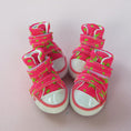 Cargar la imagen en la vista de la galería, Two pink star-patterned high-top dog sneakers shown front side by side on pale surface.
