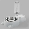 Cargar la imagen en la vista de la galería, White automatic pet feeding station with stainless steel bowl and water bottle on plain background
