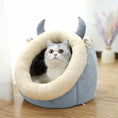 Load image into Gallery viewer, Gray and cream plush cat cave with horns and ears, showing a gray and white cat looking outside the opening.
