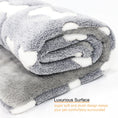 Load image into Gallery viewer, Rolled plush gray pet bed mat with white bone pattern showing thick soft material
